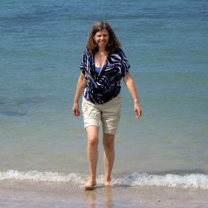 Anita Schlarb walking on a beach